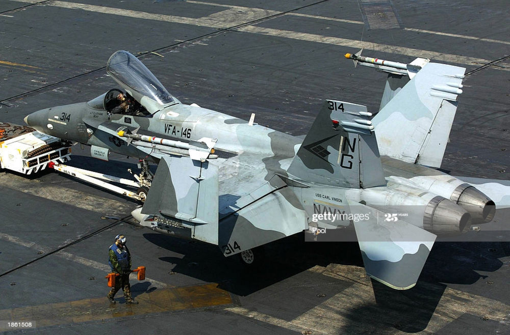the-catapult-crew-arranges-the-launch-of-a-fa18c-hornet-on-the-flight-picture-id1861508.png