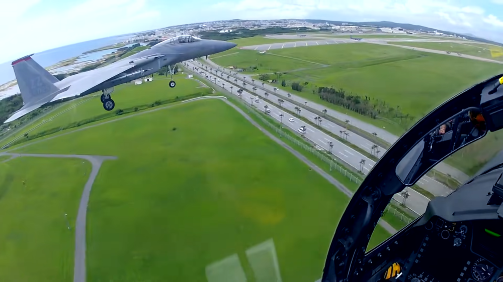 Kadena holding hands for landing.png